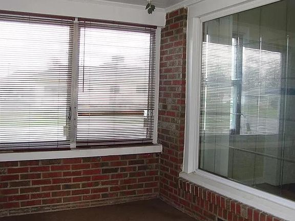 Porch and picture window to apartment