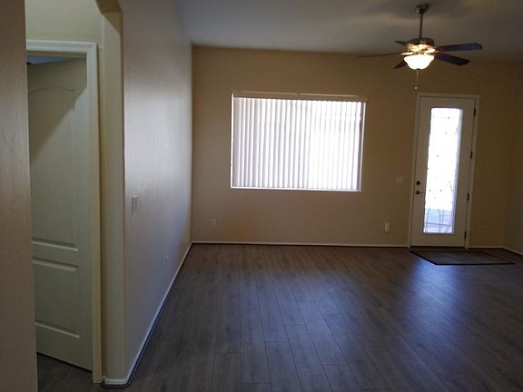From entry to living room, door to patio. Master suite on left.