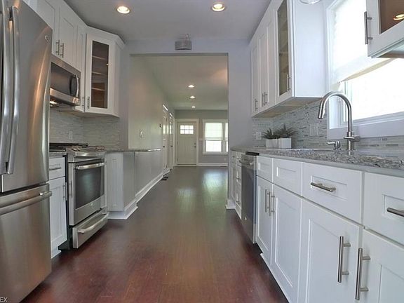 Kitchen with stainless steel appliances, pot filler, granite