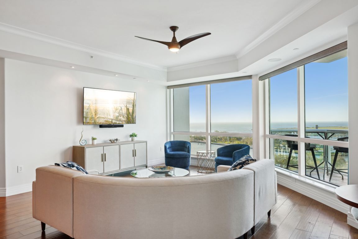 Living room/dining room/ kitchen with sweeping water views