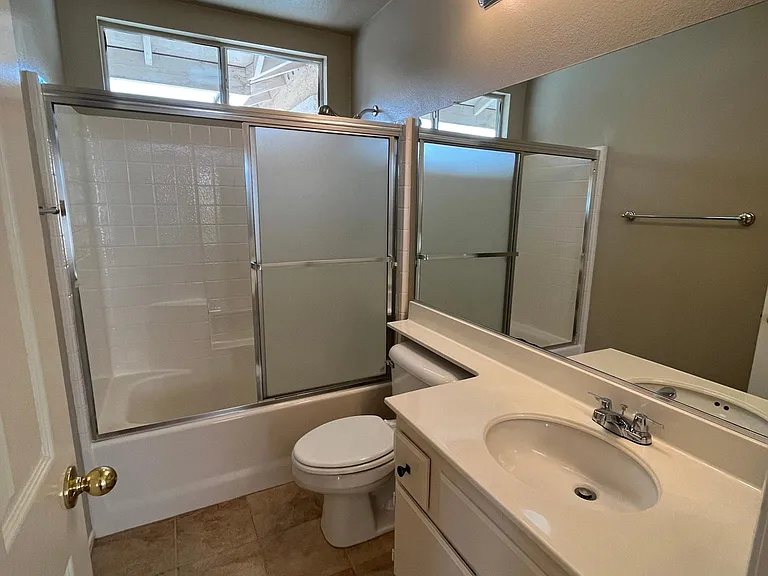 Upstairs bath with glass shower door