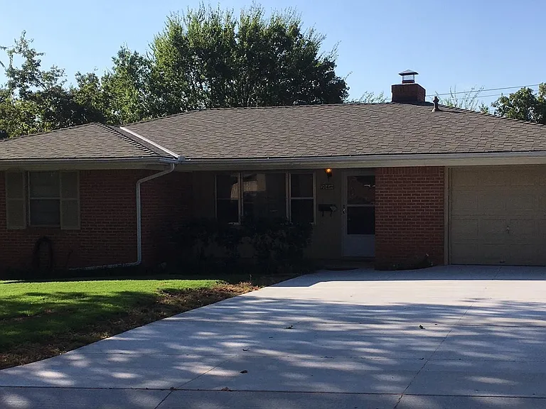 Front with new 2 car driveway