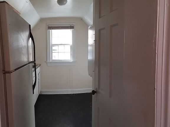 Kitchen has pantry and fullsize refrigerator and stove.