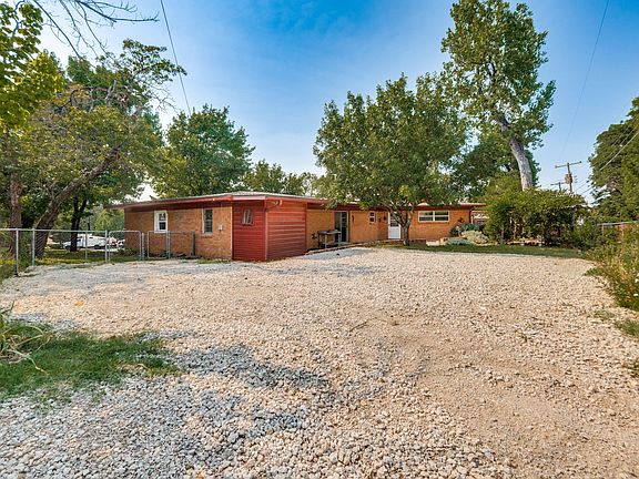 Ample parking for 56 cars, including 2 covered carports (not shown in photo)