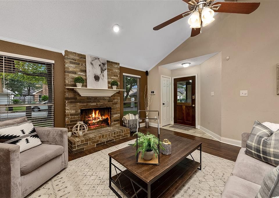 Bright open living room greets you upon entry