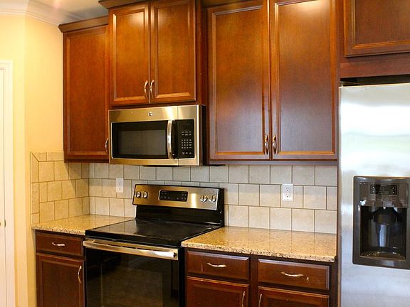 Modern upgraded cherry cabinets, granite countertops, stainless steel appliances