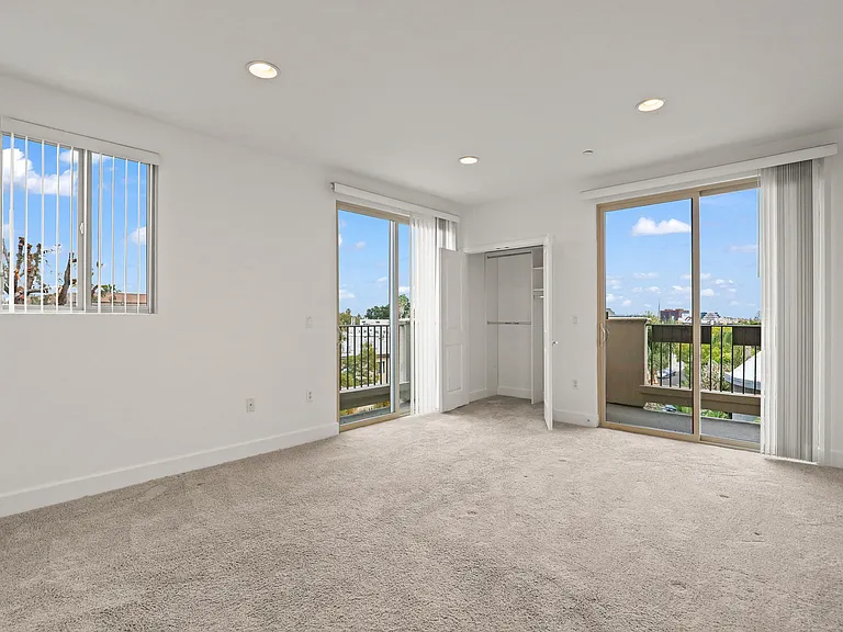 Spacious Bedroom with Patio Access and Closet Storage