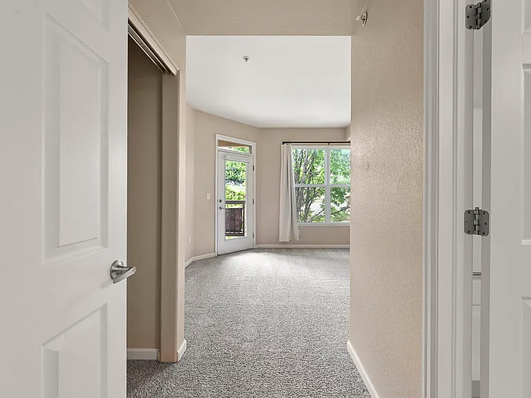 Second Bedroom Entry: Closet, patio access, natural light, and access to jack-and-jill secondary bath.