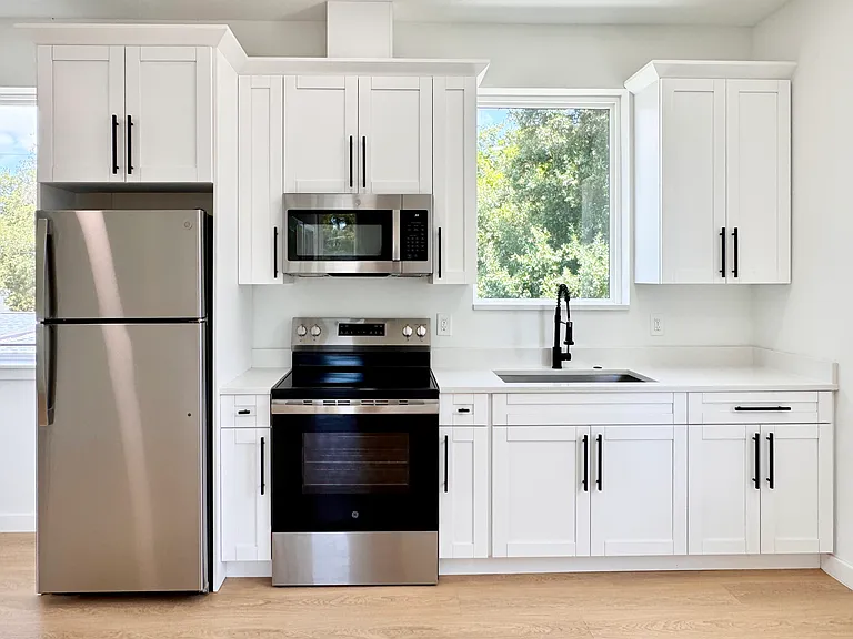 New stainless steel appliances and generous cabinet space.