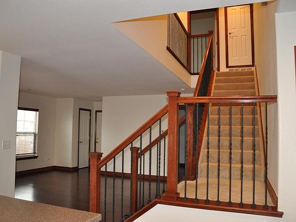 Looking into living room and up stairs.