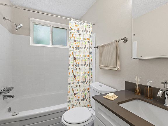 Charming full bathroom with updated fixtures and cheerful design touches