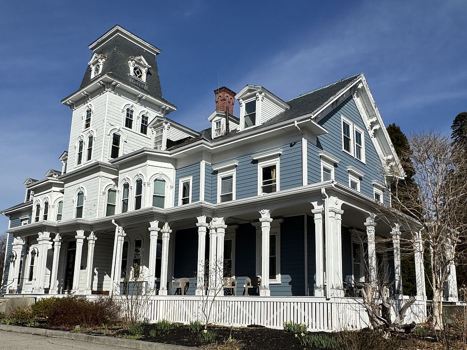 South Side of the Frank Jones Mansion. We removed the old siding and changed to the blue. This is a really high-tech upgrade made of stone that is impervious to water but looks just like wood. Can't decide if tower should be blue or white.