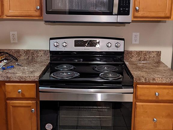 Brand new mounted microwave and range