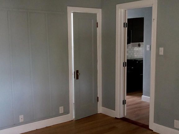 Bedroom, doorway to hallway, and restroom