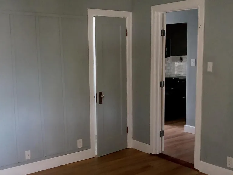 Bedroom, doorway to hallway, and restroom