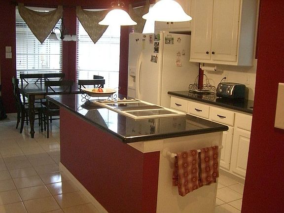 Kitchen features granite countertops