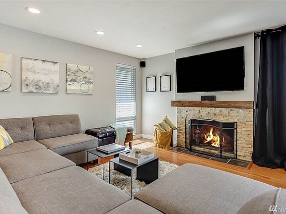This living room is wired for surround sound and a convenient outlet to manage all of your cabling hook ups.