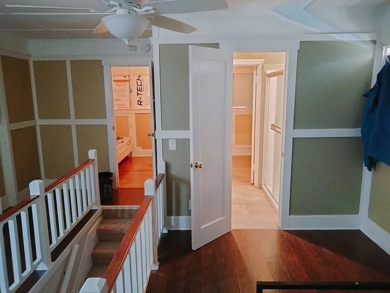 upstairs bonus room bathroom and bedroom in distance