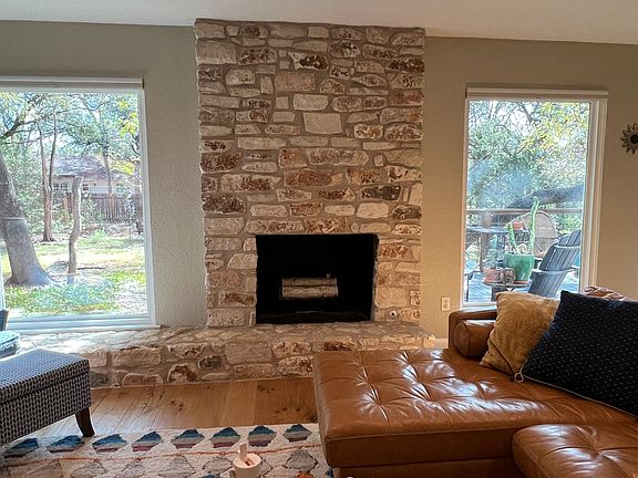 Living room with 2 new portrait windows overlooking greenbelt