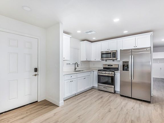 Kitchen
With full size Washer and Dryer at the end of the hallway.