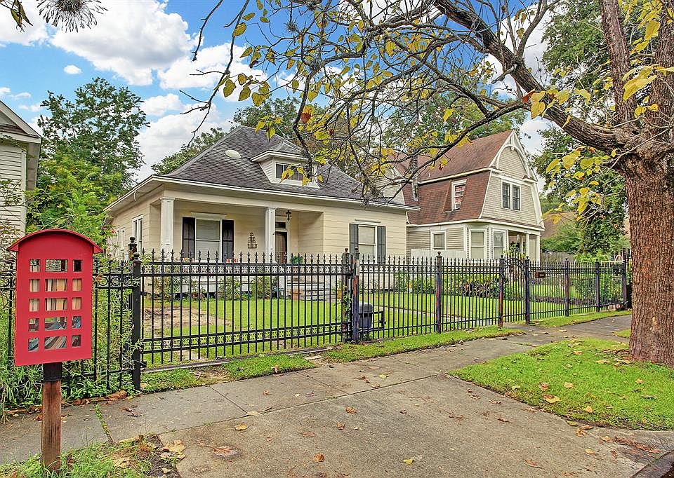 Cozy and gated with an adorable book library out front.
