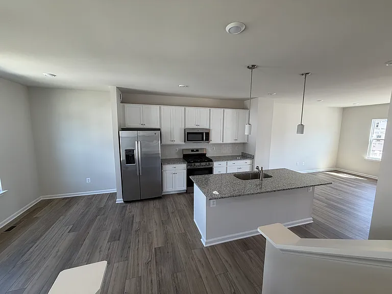 Kitchen with Island & Stainless Appliances