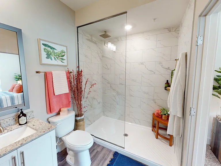 Walk-in shower with waterfall shower head