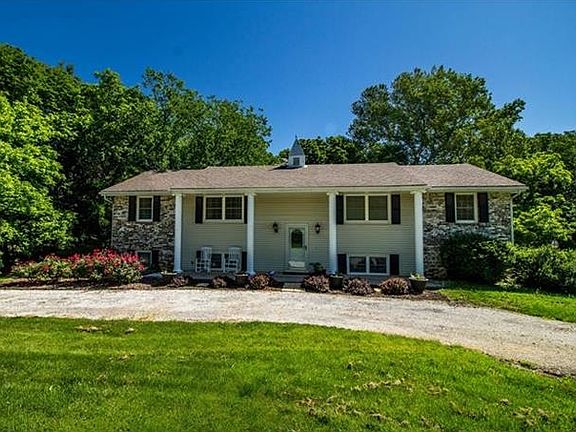 The majestic columns are aluminum and brick facing makes this an easy to maintain property.