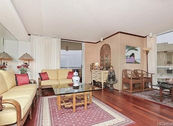 Additional lounging or dining area to side of living room.