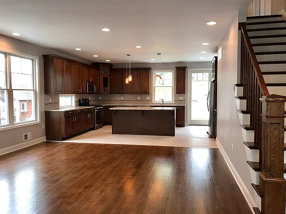 Kitchen features stainless steel appliances, granite and an