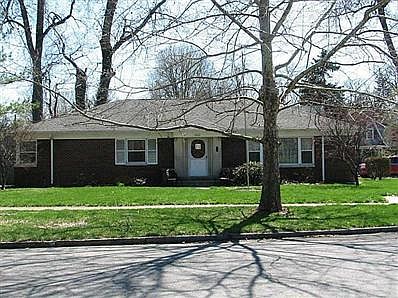 Exterior Front. Lovely corner lot with many mature trees
