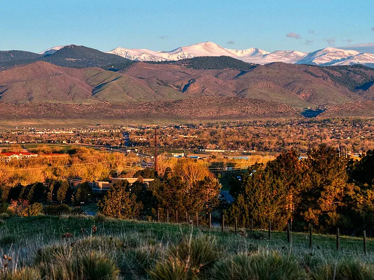 At the base of the foothills and near multiple hiking trails