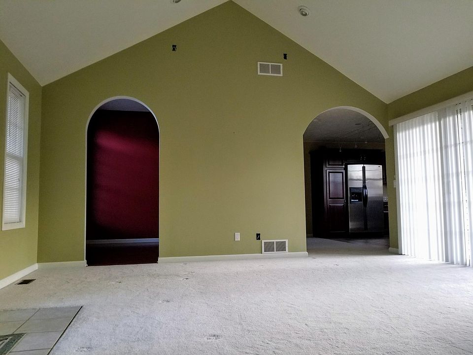 Living room facing the dining room and kitchen