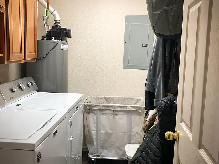 Laundry room (machines not included) next to garage