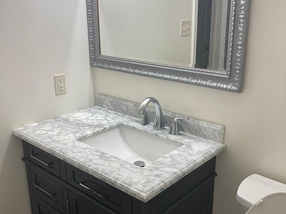 Completely renovated and updated with marble sink and beautiful charcoal vanity.