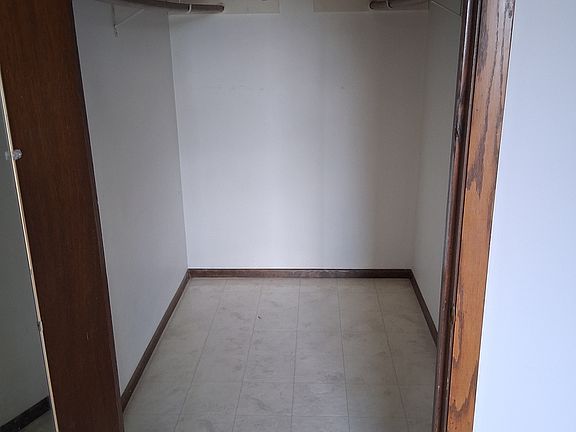 Large walkin closet in primary bedroom.