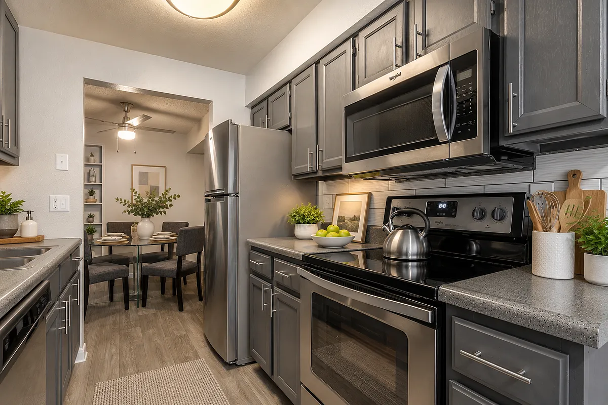 Modern galley kitchen with dining nook - Woodstream Village