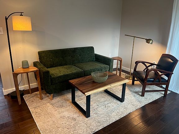 Comfortable living room with large slider to covered side patio.