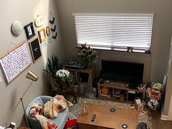 Unit 1 living room with high ceiling