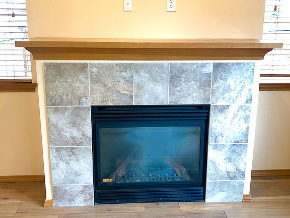 Wonderful gas fireplace with wiring above for TV
