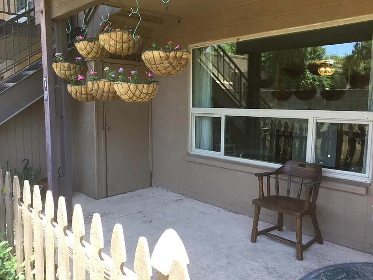 Patio with storage shed.
