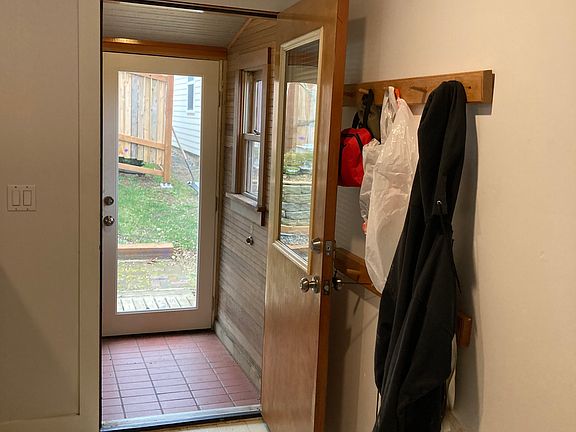 Exit to rear of house, including tile-floor mudroom