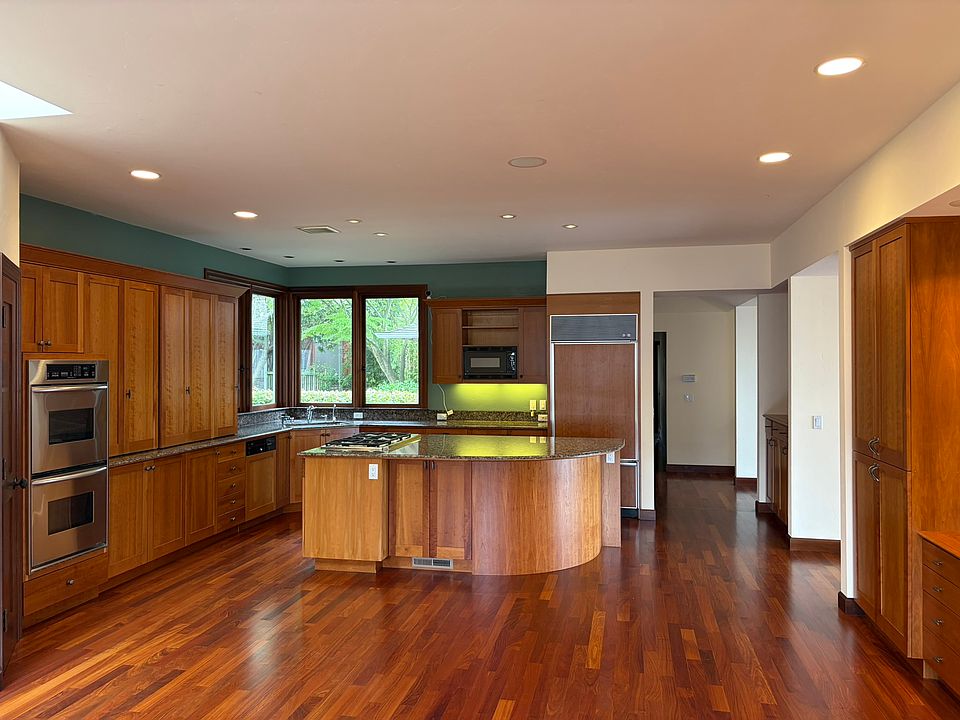 Plenty of storage on both sides of kitchen.