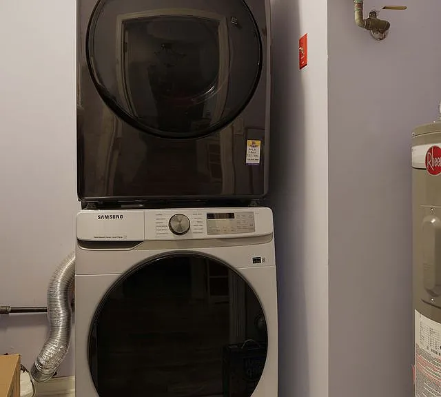 In unit Washer and Dryer are tucked away in the utility closet that has extra shelving