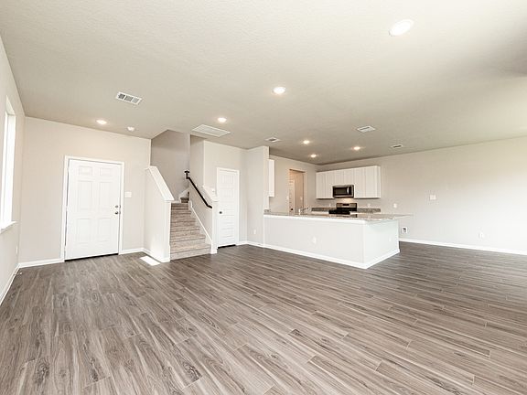 Family Room to Kitchen and Dining Area