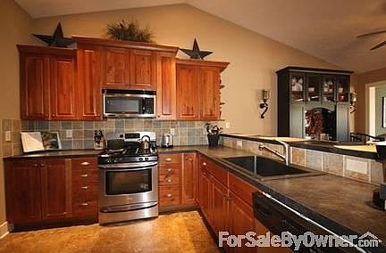 Kitchen Rustic Cherry Cabinetry
						:
						Buyer has option to select new granite countertops. Choose from 25 color options