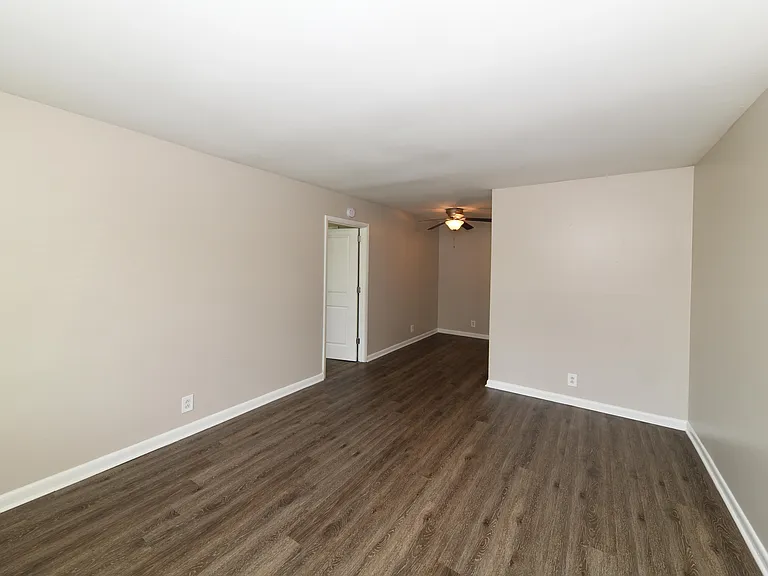 Spacious living room with hardwood-style flooring