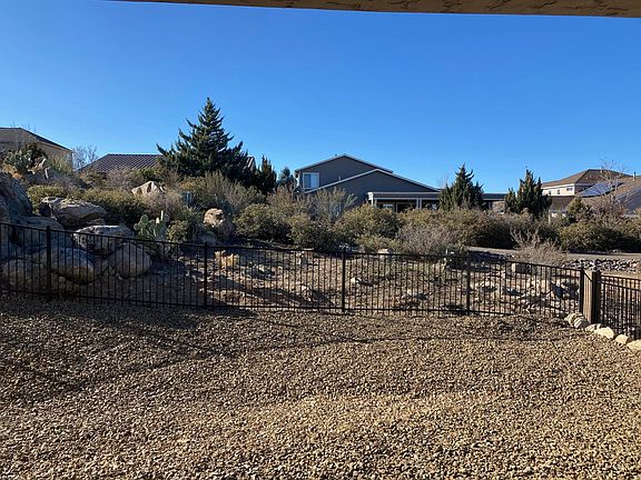 Backyard behind Covered Patio