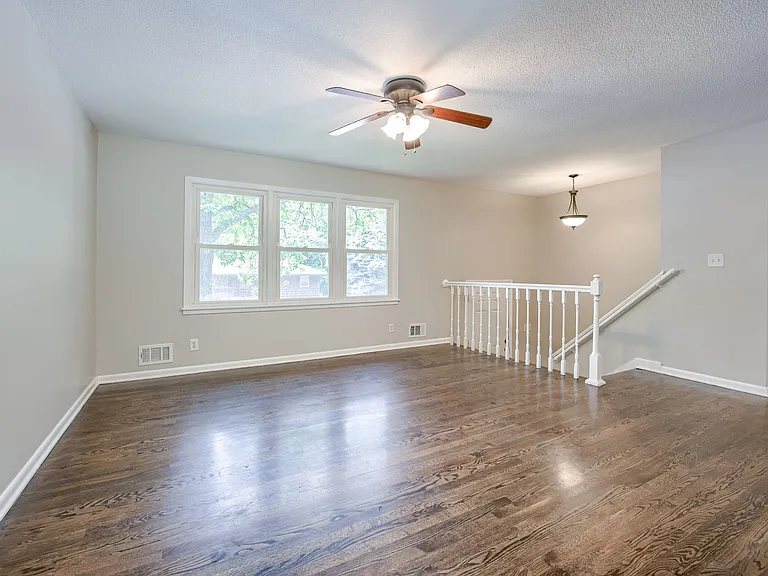 Living Room (unfurnished) featuring nice hardwoods