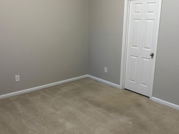 Sunny Master Bedroom with vaulted ceilings, full bathroom and walk in closet. Located on first floor.